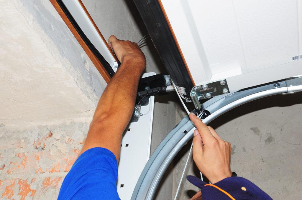 Contractor repair and install garage door. opener. Replace, Repair a Broken Garage Door Spring.